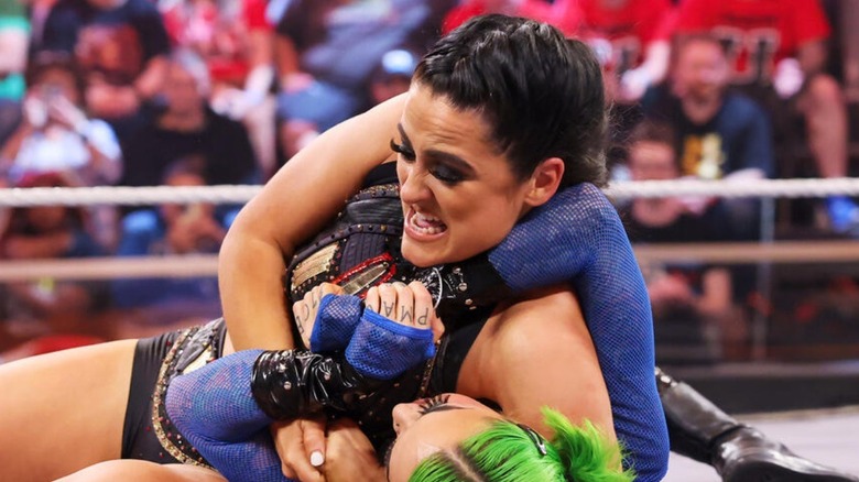Lyra Valkyria puts Shotzi in a headlock