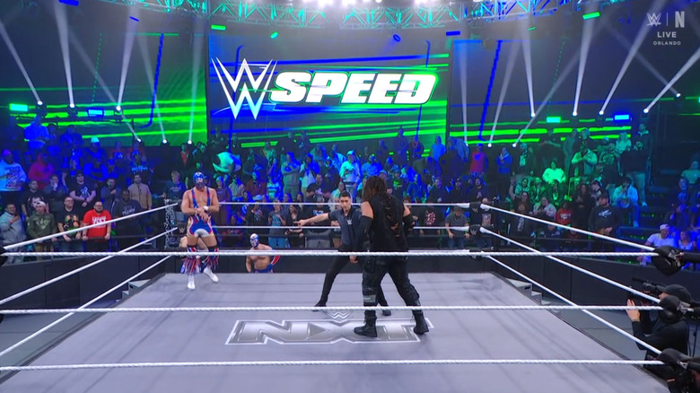 Grande and Troy staring one another down