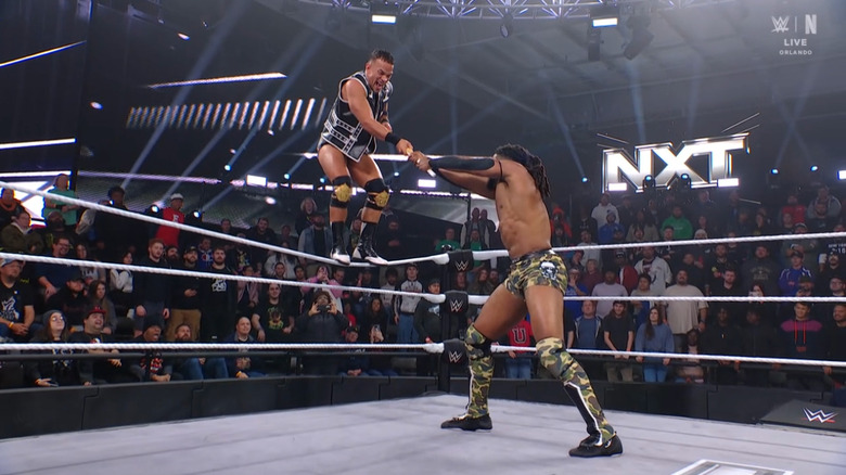 Saints and Williams wrestling over the kendo stick