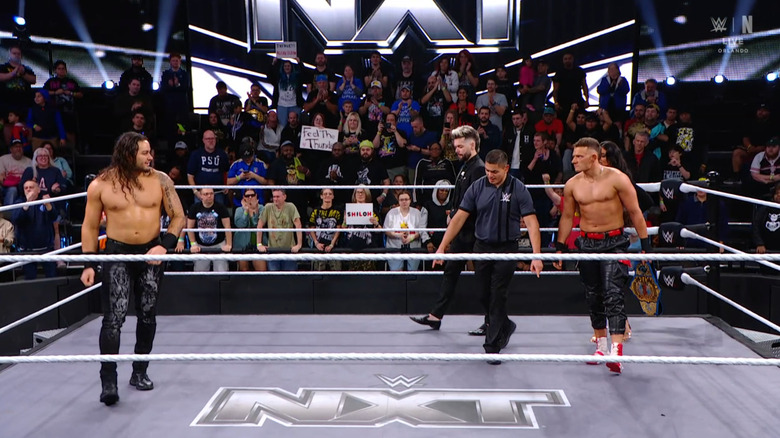 Hill and Stacks staring one another down in the ring