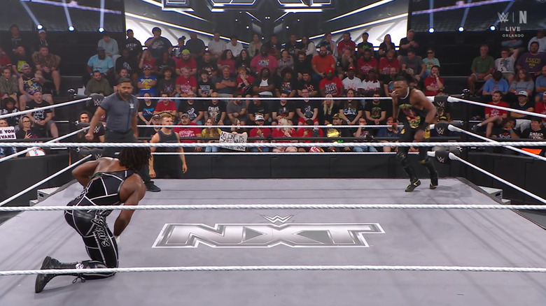 Shugars and Evans staring one another down in the ring