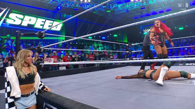 Zaria standing over Sinclair