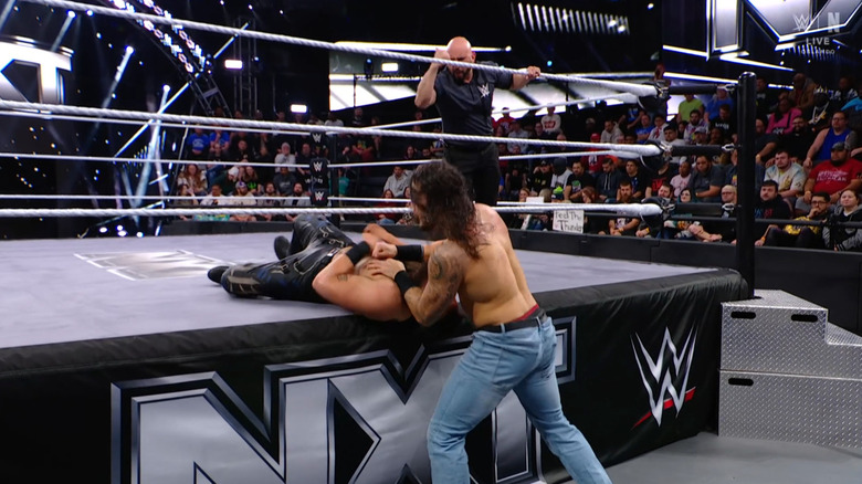 Hill and Briggs on the outside of the ring