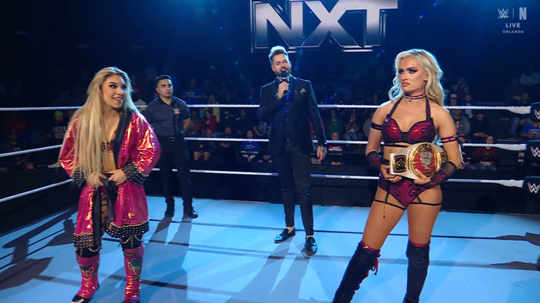 Hail and Monroe staring one another down in the ring during the ring announcement