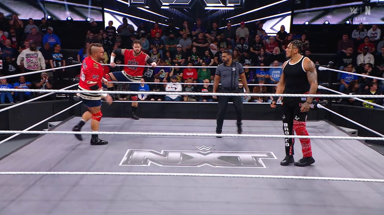 Ledger and Nima staring each other down in the ring