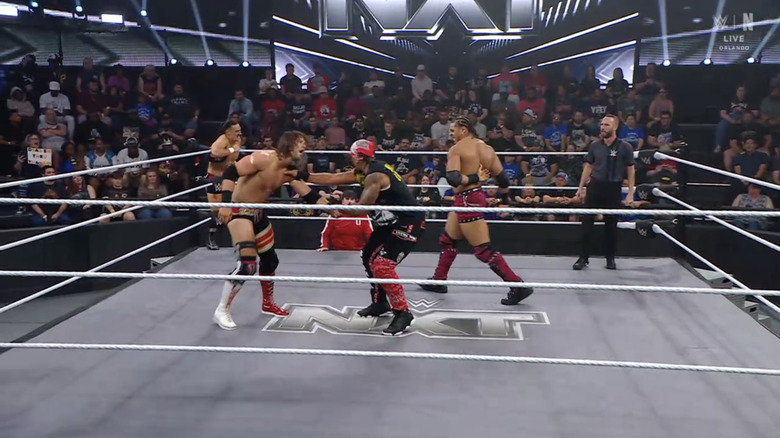 Bronco Nima and Lucien Price look to put some tag team action onto Kale Dixon while Uriah Connors watches on helplessly.