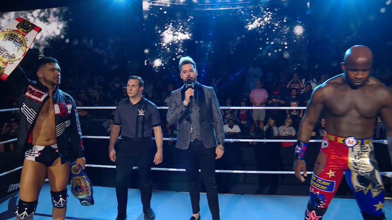 Page and Moose in the ring during the ring announcement