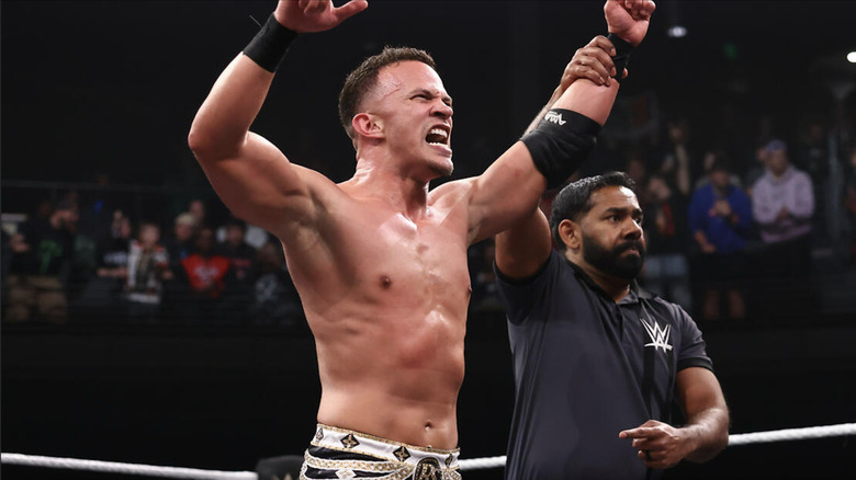 A referee holding up Saints' hand