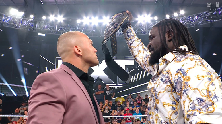 Borne and Femi staring one another down in the ring