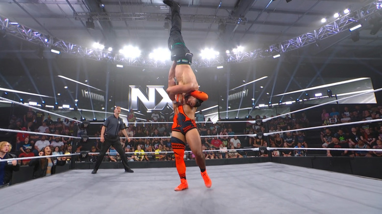 Heights with Santana up for a delayed vertical suplex