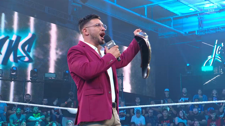 Page holding up the North American Championship