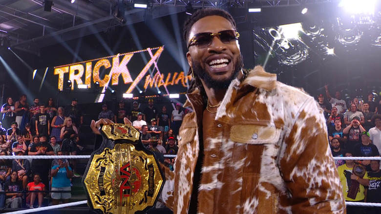 Williams holding up the TNA World Championship