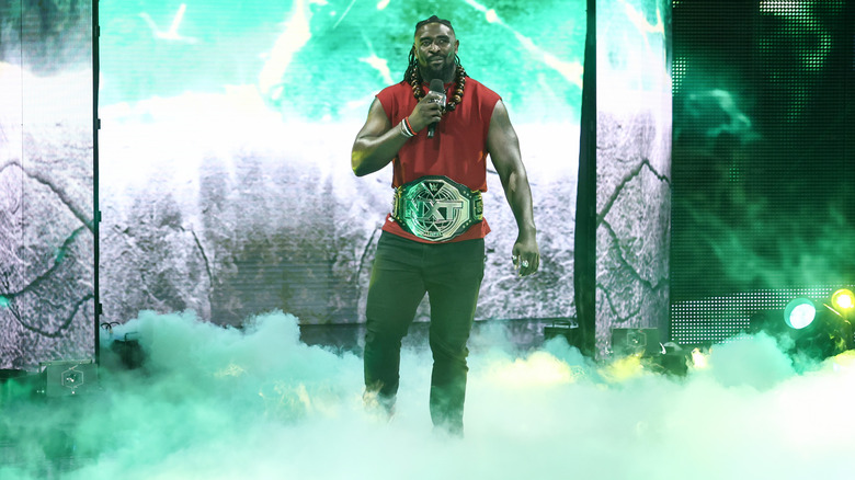Femi on the entrance ramp with his NXT Championship belt