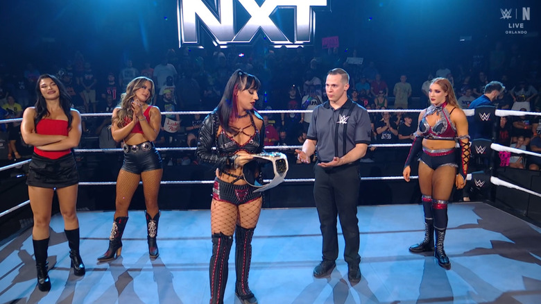 Fatal Influence and Reid inside the ring