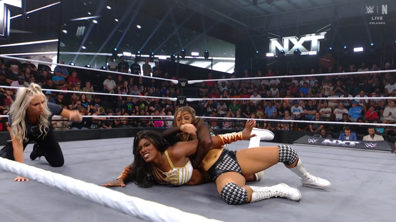 Sinclair with a submission cinched in on Legend