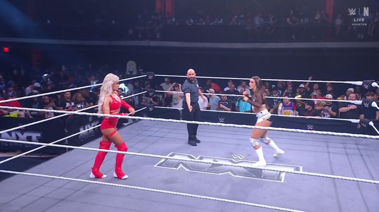 Monroe and Sinclair about to lock up in the ring