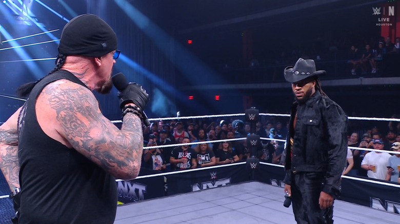 Undertaker and Williams speaking in the ring