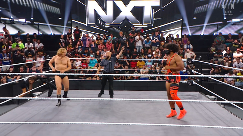 Dempsey and Heights staring each other down in the ring