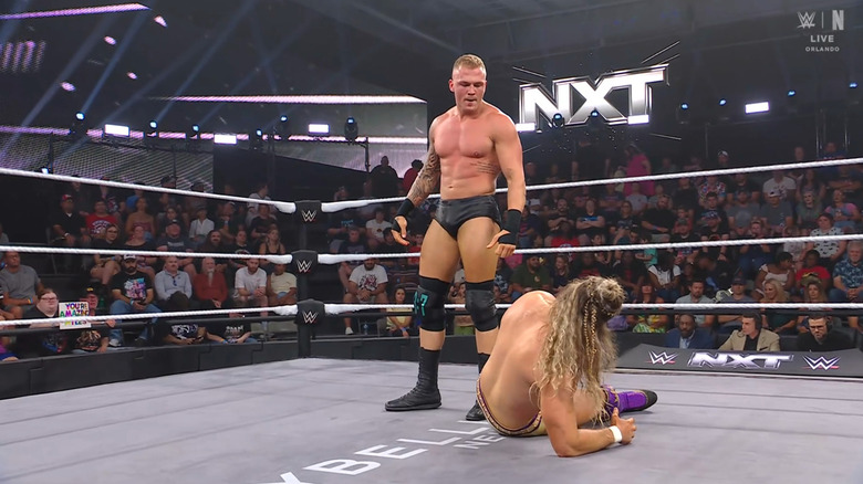 Borne standing over King