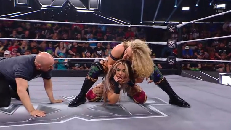 Lyons wearing down Hail with a submission hold
