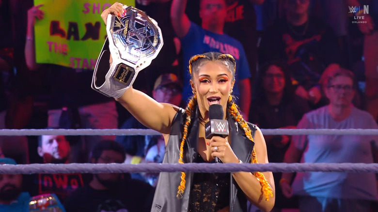 Jordan speaking and holding up her NXT Women's Championship