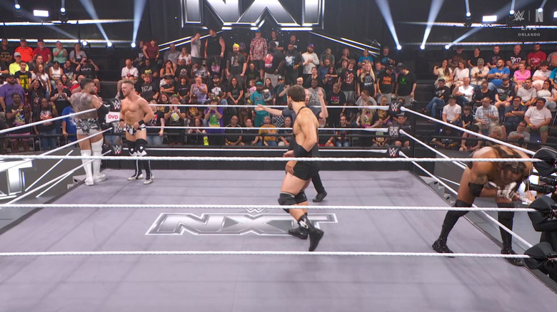 All four men inside and around the ring