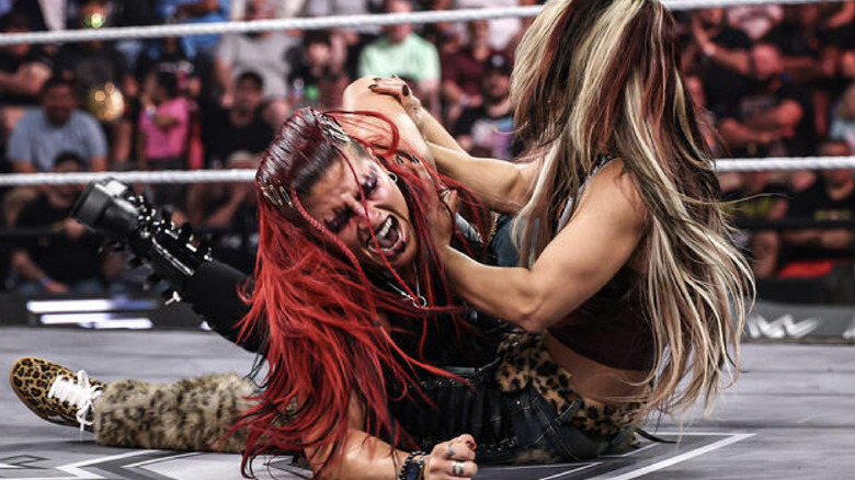 Hail with Zaria in a submission hold