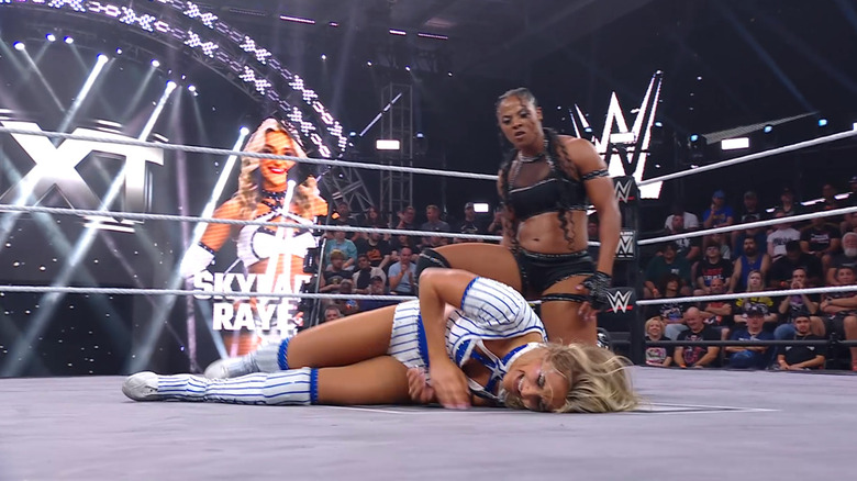 Armstrong kneeling over Raye