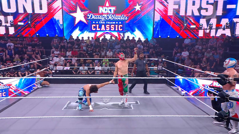 All four men inside and around the ring