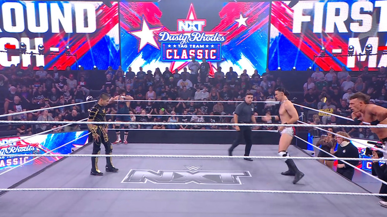All four men inside and around the ring