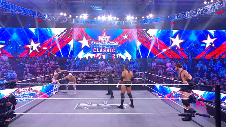 All four men inside and around the ring
