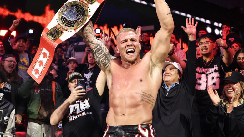 yles Borne celebrates his "NXT" North American Championship reign with the crowd.