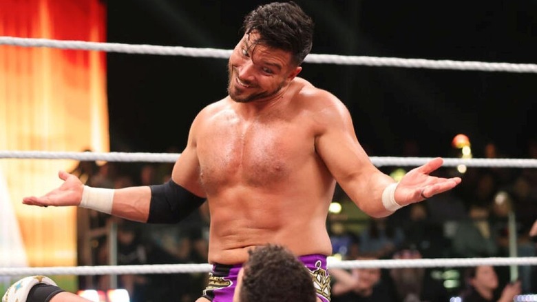 Ethan Page smiles and spreads his hands at WWE NXT Stand & Deliver