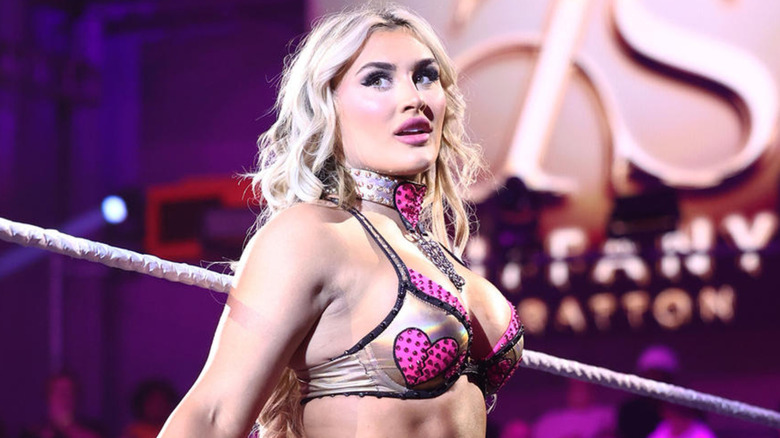Tiffany Stratton leaning against the ring ropes