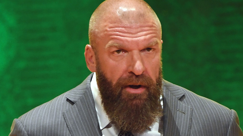 Triple H speaking at a conference