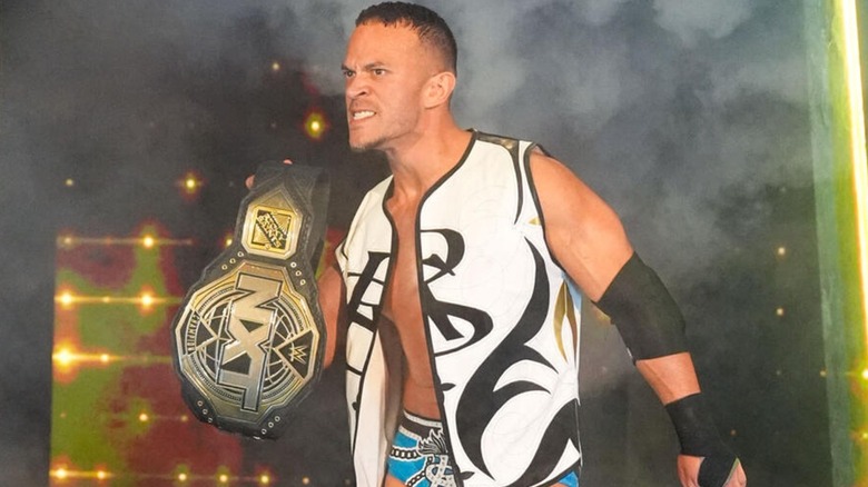 Ricky Saints with the NXT Championship at the 