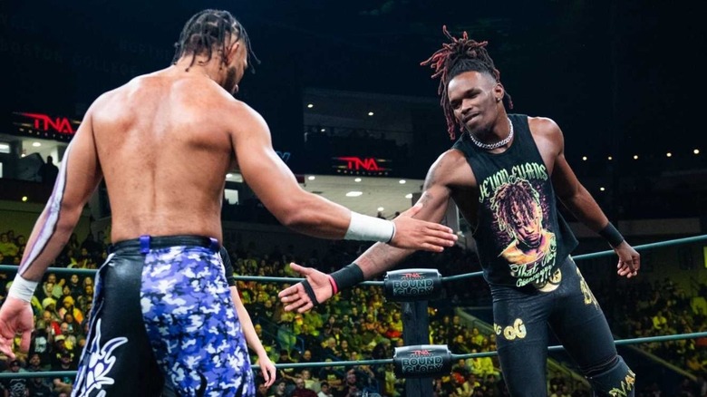 Je'Von Evans and Leon Slater slap hands before their match for the X-Division Championship at TNA Bound for Glory.