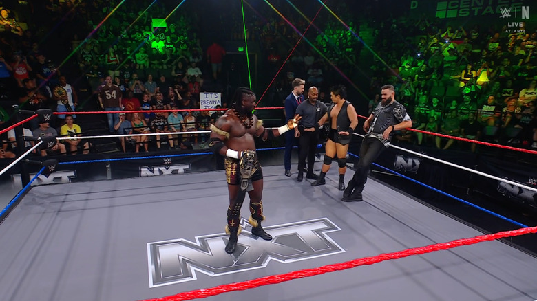 Femi, Inamura, and Briggs inside the ring