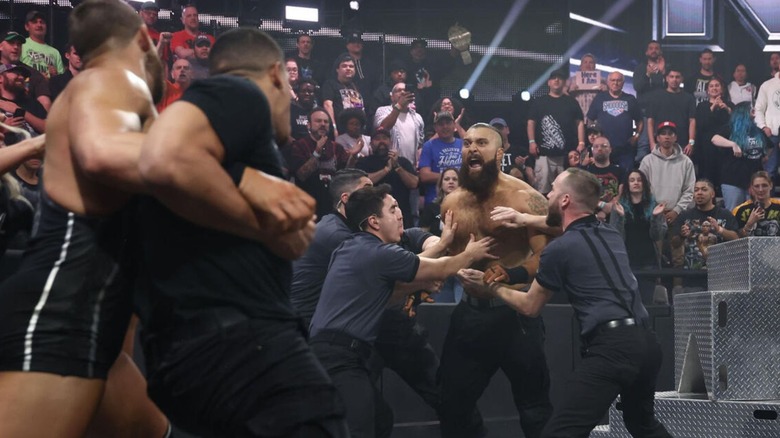 "WWE NXT" officials separate Tony D'Angelo and Dion Lennox at ringside following a D'Angelo victory over Cutler James on an edition of the show.