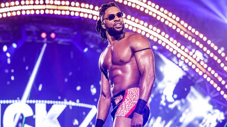 Trick Williams posing with his sunglasses