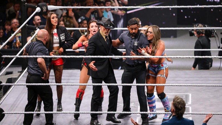 Both Kendal Grey and Lola Vice make their cases known to Shawn Michaels and two referees following their match ending in controversy on an episode of 