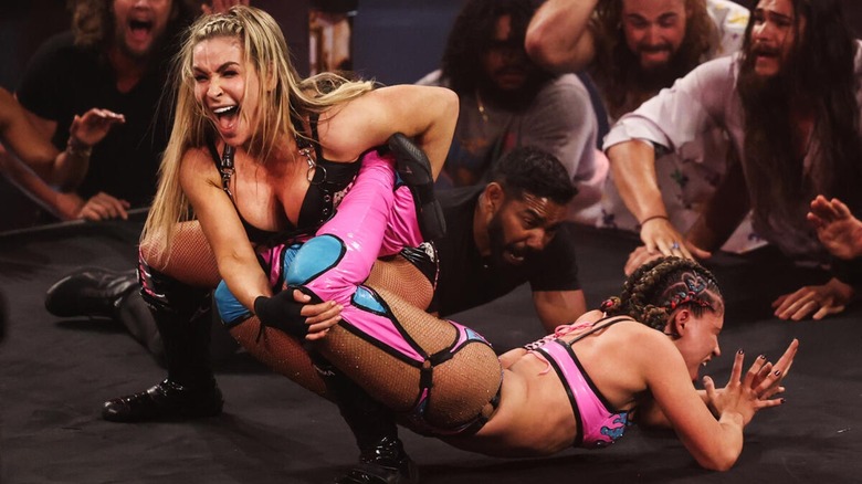 Natalya puts Lola Vice in the Sharpshooter