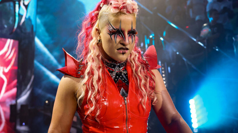 Zaria wearing a red ring jacket