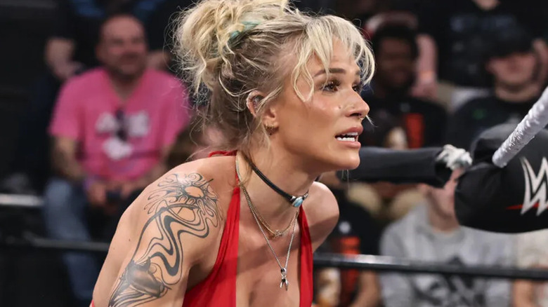 Sol Ruca is wearing a red halter top