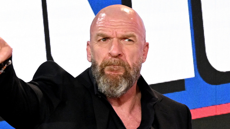 Triple H points at a fan