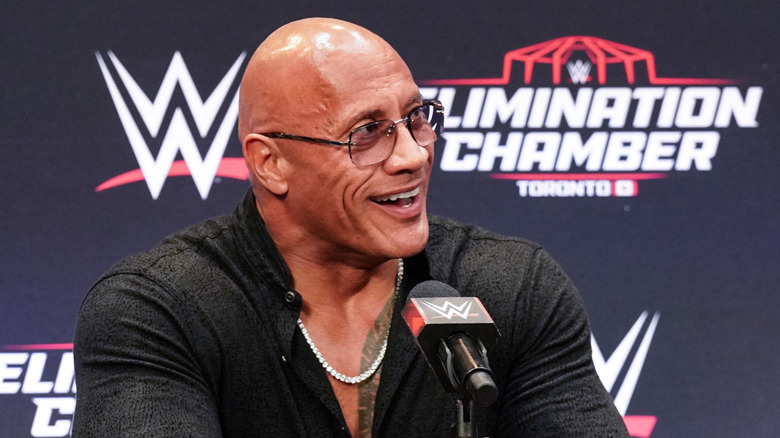 Dwayne "The Rock" Johnson smiles on during a WWE sponsored press conference