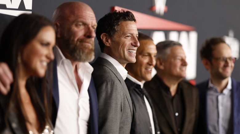 TKO executives with Mark Shapiro in focus