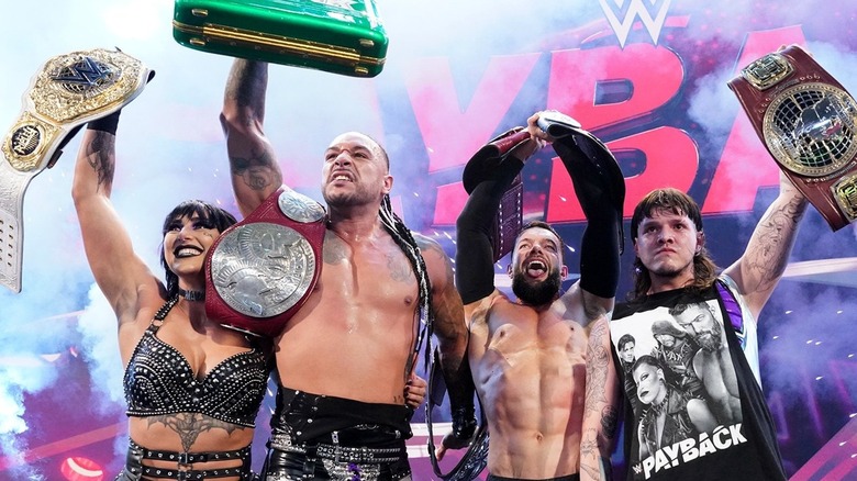The Judgment Day members show off all their title belts