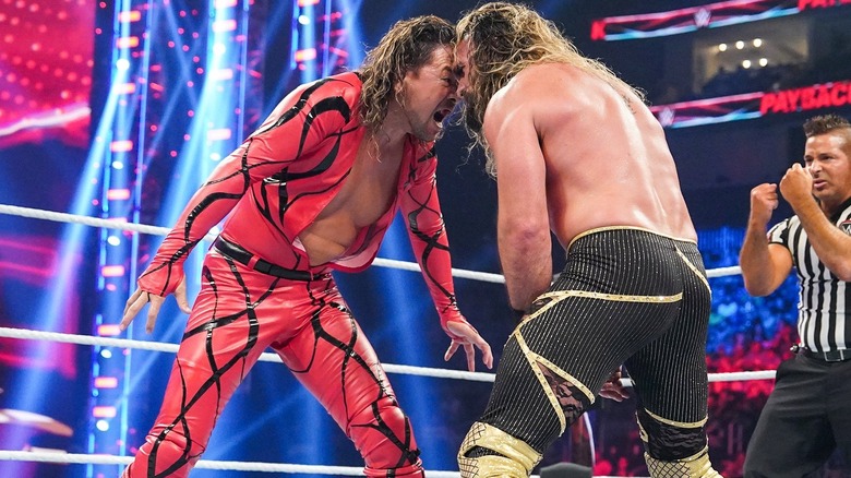 Shinsuka Nakamura and Seth Rollins stand nose to nose