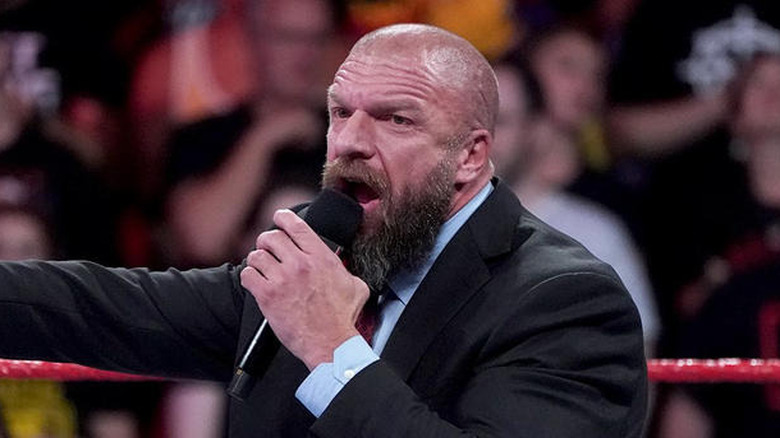 Paul "Triple H" Levesque talking into a microphone